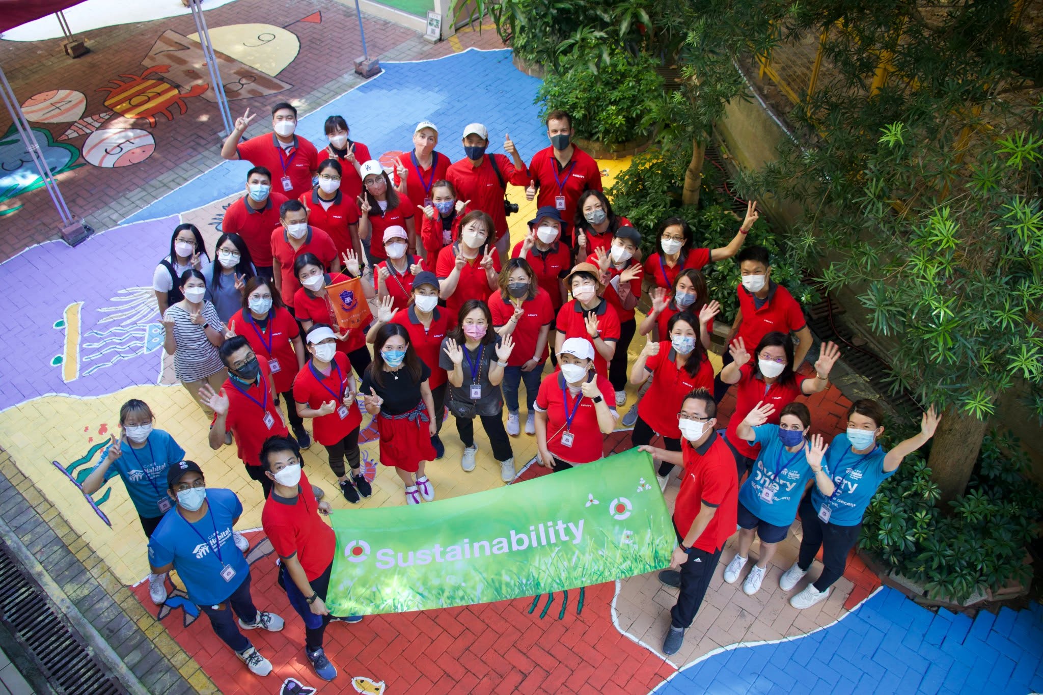 A large group of Habitat volunteers gathered together