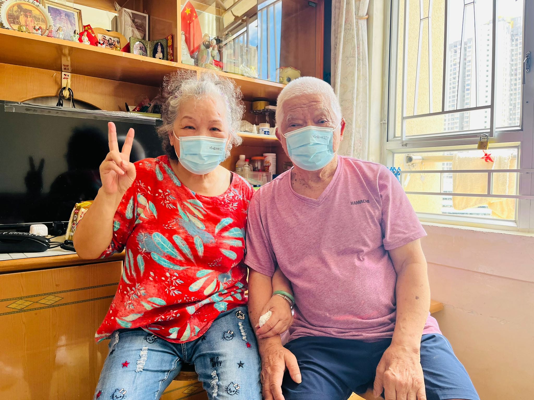 An elderly couple at home after repairs