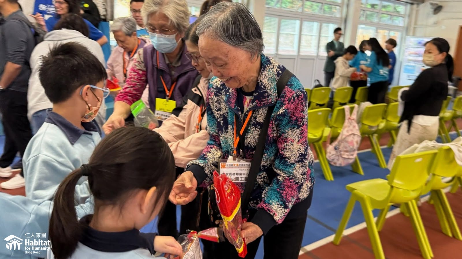 Volunteers and children at a community workshop