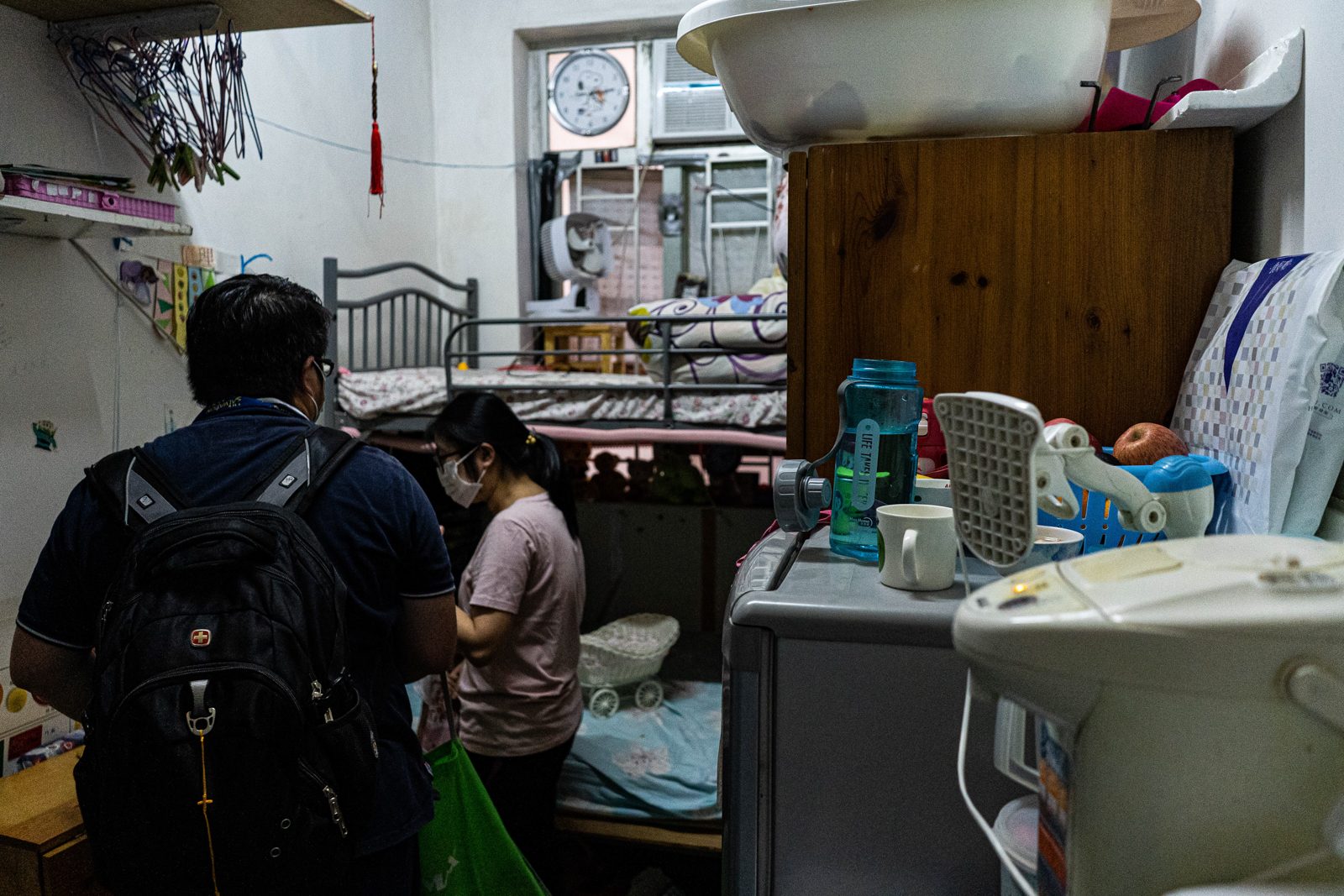 Habitat volunteers visiting a resident's home before a repair and cleaning session